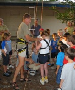 Elementary school students learning how to rappel, a skill necessary for exploring and collecting data in caves.