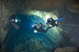 Terrence (left) explores and surveys a lava tube in Lanzarote, Canary Islands  (Photo, courtesy ©Jill Heinerth, IntoThePlanet.com)