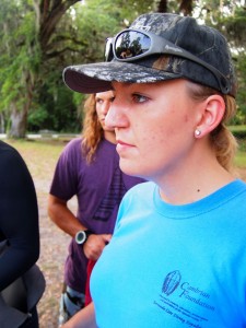 Project director Marissa Williams listens intently as the team prepares for the day's dives.